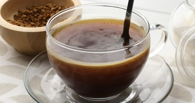 Making instant coffee at light table, closeup