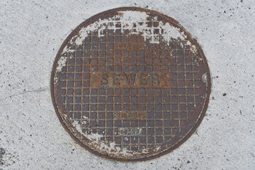Sewer manhole cover. Made in USA.