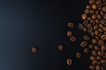 Scattered coffee beans on the side