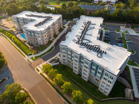 Sunset Drone Images of Large TPO Roofs on Commercial Buildings and Apartments: Architecture, Industry, Engineering