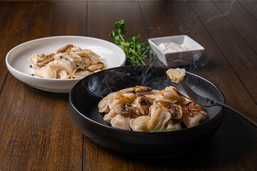 Fork with dumpling over rustic dinner table