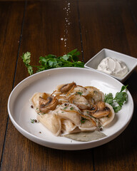 Homemade dumplings with mushrooms and herbs