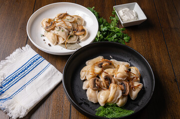 Traditional dumplings with mushrooms and herbs on plate