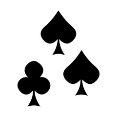 Three suits of playing cards, a club and two spades, on white