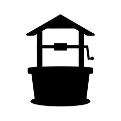 Silhouette of a classic water well with a roof and crank