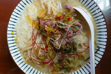 top view sour soup beef noodles
