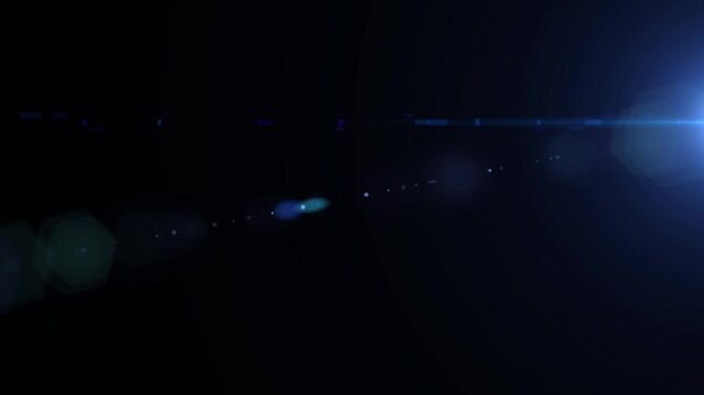 Blue-white lens flare streak cutting through a black background, ideal for cinematic overlays or motion design.