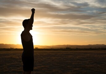 Fototapeta premium Silhouetted Man Celebrates Sunset in Open Field. Generative Ai