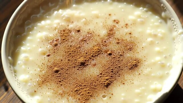 Sprinkling cinnamon on arroz doce &ndash; Brazilian dessert video