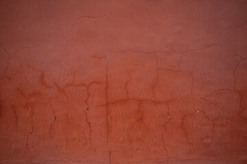 Texture red concrete plaster wall rough surface background.