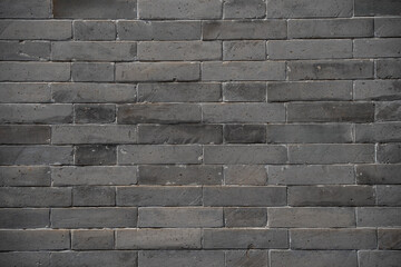 Dark stone brick wall for pattern  texture background,