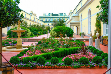 Inside St. Petersburg's Winter Palace, opulent halls boast dazzling chandeliers, gilded columns,...