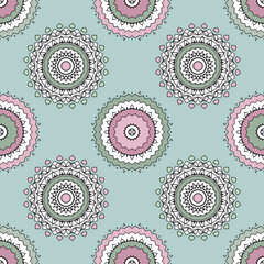 Fototapeta premium Pink turquoise openwork kaleidoscope on a Greenish background