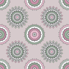 Pink turquoise openwork kaleidoscope on beige background