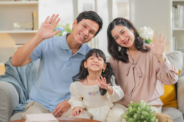 Portrait of happy multi-generation Asian family with dad mom and kids using smartphone digital...