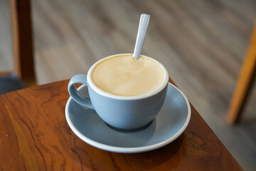 Hot Aren Latte, Indonesia, captured on July 13, 2025. A warm blend of strong local coffee, steamed...