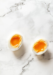 Flat lay photography of halves of tasty boiled eggs. Healthy breakfast