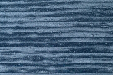 Close-up macro shot of blue textured fabric with horizontal pattern