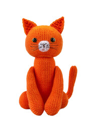 A handmade orange knitted cat doll sits against a black backdrop, showcasing a charming and playful toy crafted with yarn, transparent background