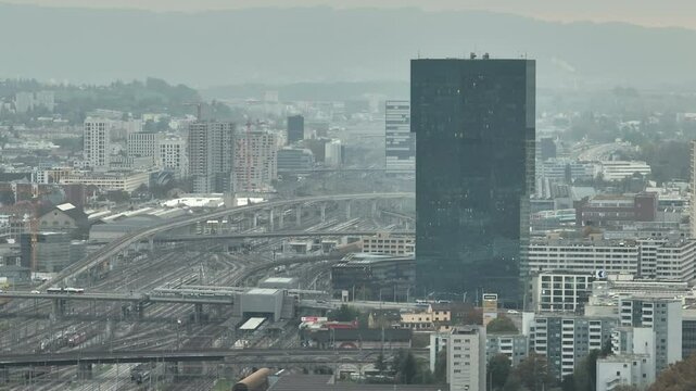 rainy day zurich city train traffic railroad famous office tower area aerial panorama 4k switzerland   