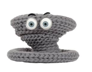 A whimsical gray knit tornado toy stands against a dark backdrop, featuring expressive eyes and a playful cartoonish design, transparent background