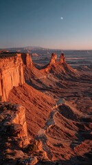 Naklejka premium Majestic Red Rock Formations Under Moonlit Sky at Sunrise