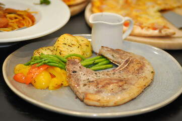 pork steak or grilled pork and salad or pork chop