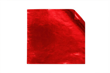 Crumpled red metallic foil with curled edge, reflecting light against transparent backdrop, showing glossy textural surface