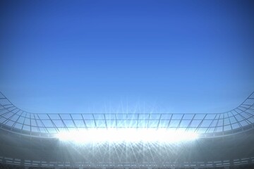 Large football stadium under bright blue sky