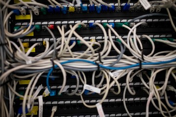 Network patch panel is being shown with tangled Ethernet cables and RJ45 connectors in flat design