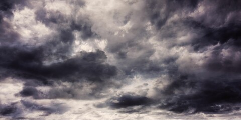 Dense dark grey clouds are being shown in open sky flat design, featuring layered storm patterns