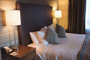 Pillows setting on bed in hotel