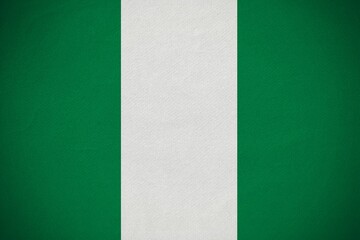 Nigerian flag is being displayed in flat design with textured green white green canvas