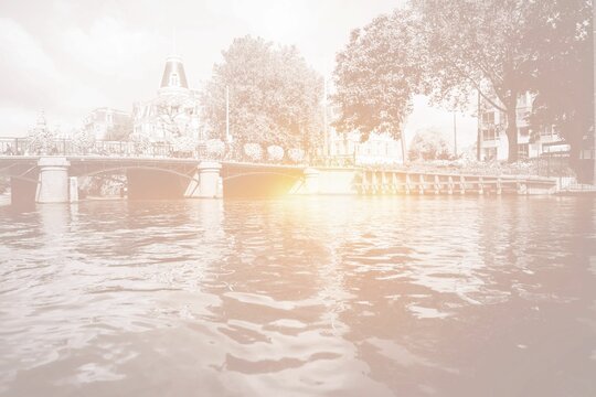 Amsterdam canal bridge with bright light