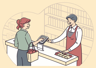 Customer pays at the checkout counter with a cashier in a store isolated on white background