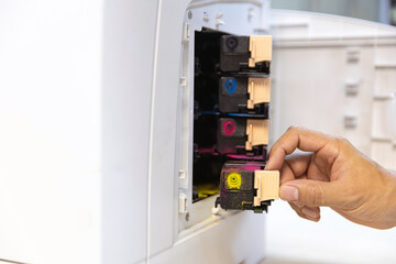 Technician Holding ink printer toner low for replace new or fix repair problem paper or print...