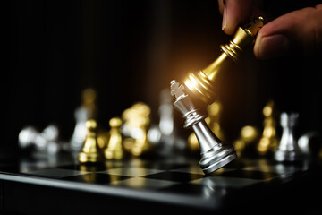 Hand choose King fight on chess falling for winner leadership strategy or wining challenge of team...