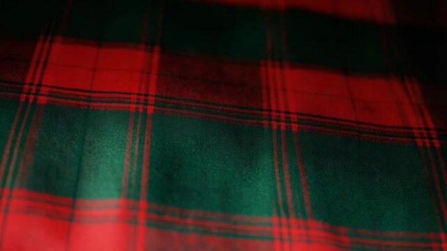 Red and green christmas plaid fabric background creating festive atmosphere