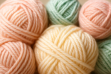 Pastel Yarn Balls Flat Lay – Peach, Cream, and Mint Green Close-Up with Soft Texture and Glow