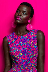 Woman in Floral Dress with Pink Accessories