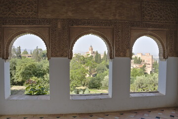View of the Alhambra in Granada from some horseshoe arched windows
