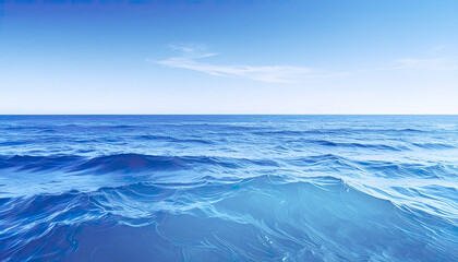Fototapeta premium Ocean water under clear blue sky with gentle waves and peaceful atmosphere