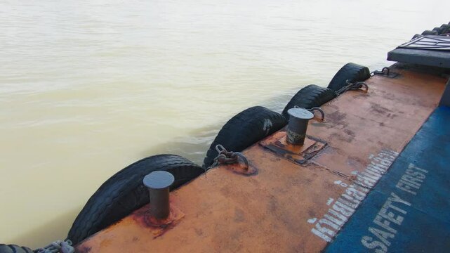 The hanging tires act as shock absorbers and fenders for the boat.