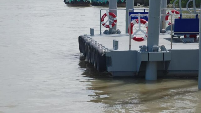 The hanging tires act as shock absorbers and fenders for the boat.