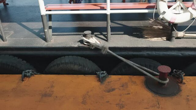 The hanging tires act as shock absorbers and fenders for the boat.