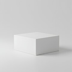 Fototapeta premium A pristine white square box sits on a light gray background, providing a simple, clean display surface.