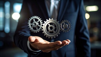 Scene with a blurred man in a suit holding three spinning gears in the palm of his hand