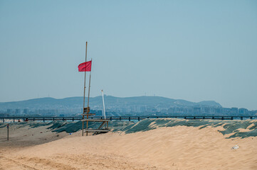 a red flag on the beach in Anapa after the oil spill in the Black Sea