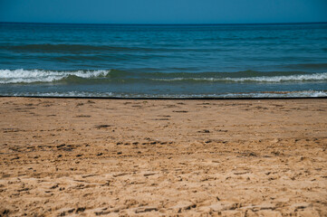 the sandy seashore in Anapa after the oil spill in the Black Sea