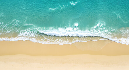 Aerial View of Turquoise Ocean Waves Crashing on Golden Sandy Beach